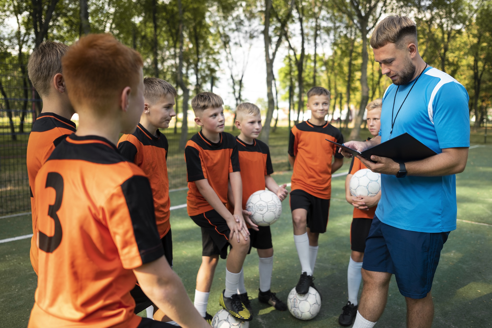 football-trainer-teaching-his-pupils